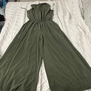 Green jumpsuit stretchy cinched waist. Sleeveless. Long and wide bottoms